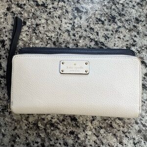 Kate Spade 100% leather double zipper wristlet.